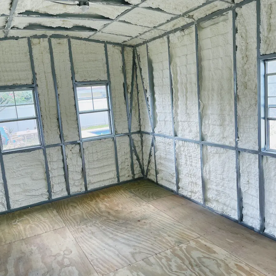 Closed-cell spray foam insulation applied to wall cavities in a residential project in Buffalo